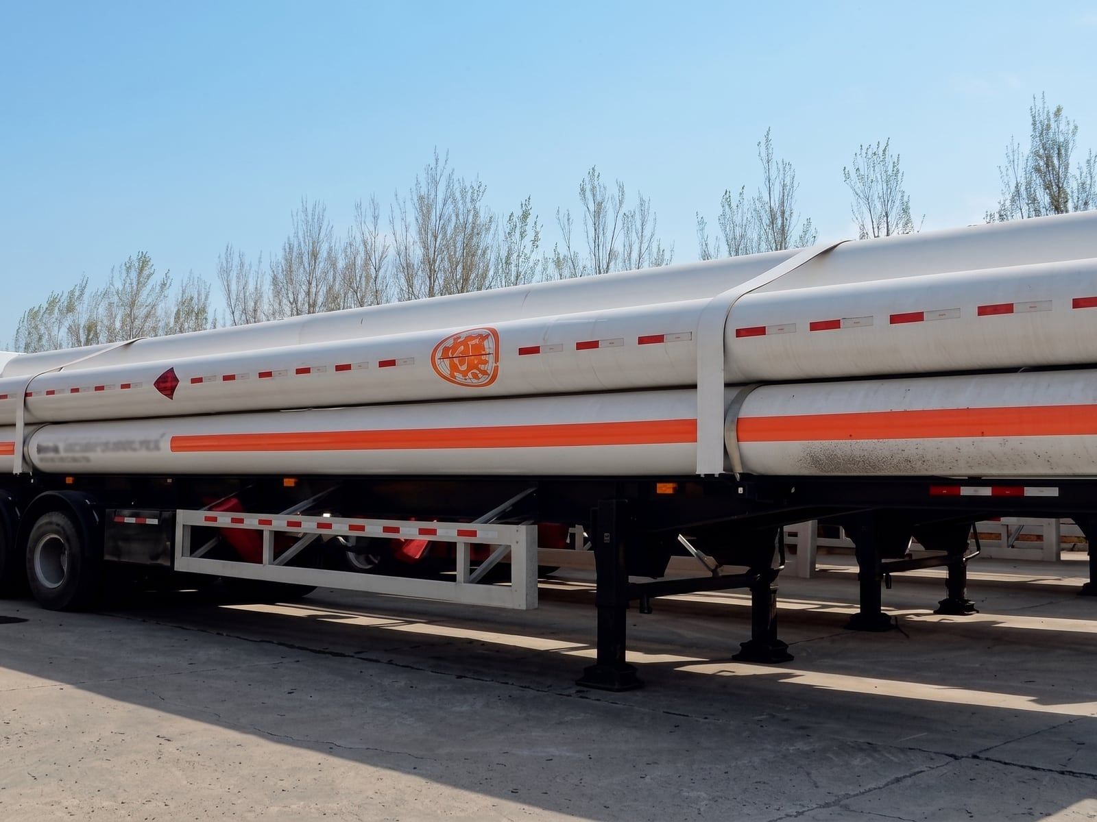 CNG Transport Semi-Trailer the cylinder bundle seen from the side, showing the hazard markings along the tubes