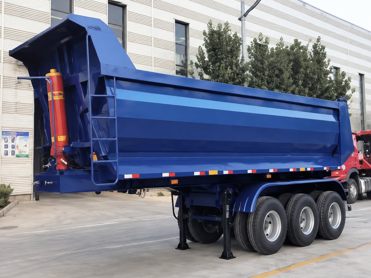 CYP9402ZZX 40 t U-Dumping Semi-Trailer tipping, body raised, seen from the rear three-quarter