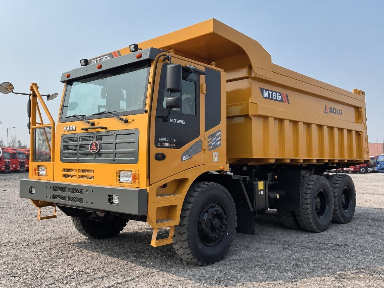 SDLG Wide-Body Mining Truck photographed front three-quarter, yellow cab, dump body empty