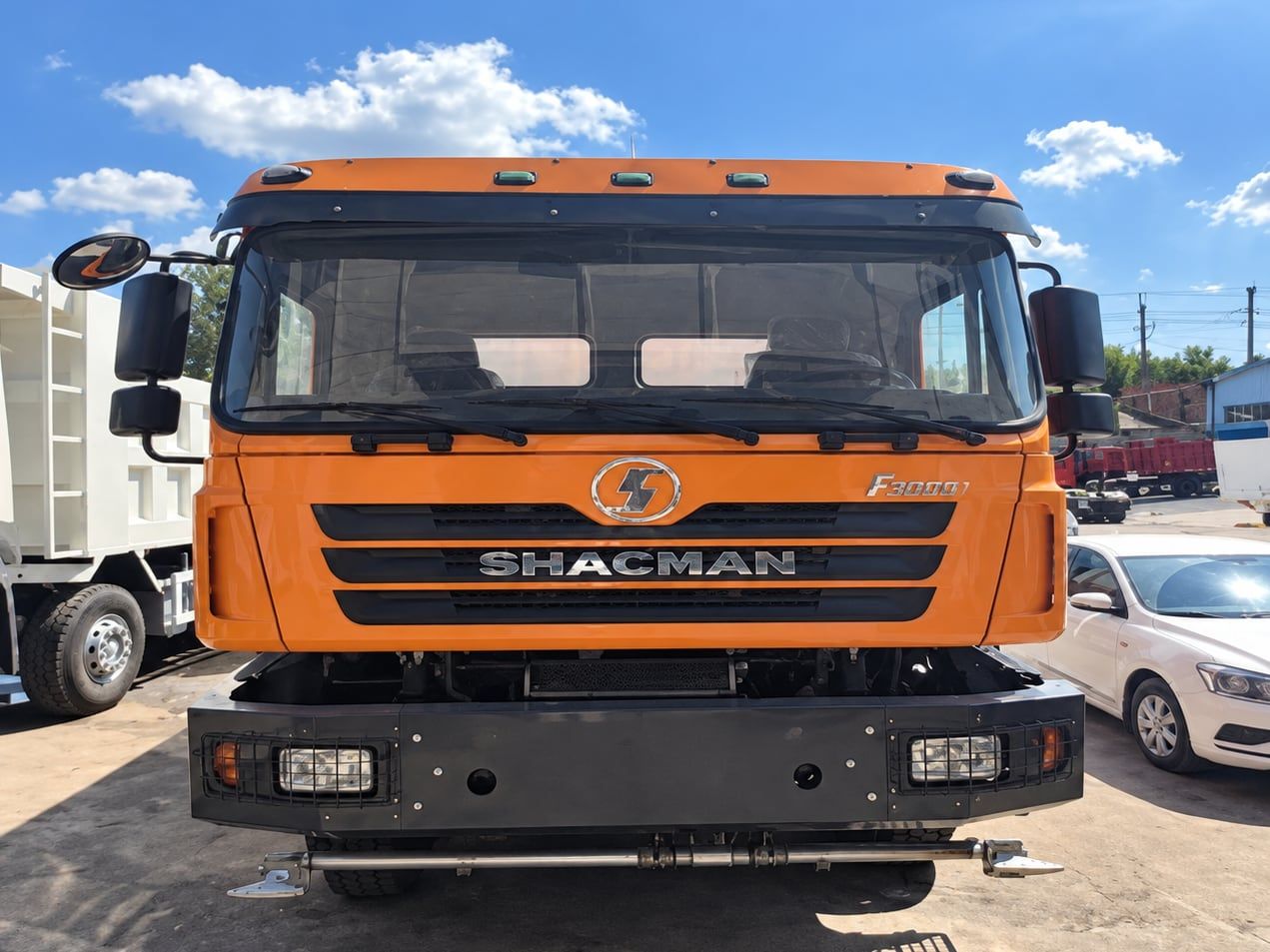 Shacman Delong F3000 6×4 Water Truck photographed three-quarter front, orange Shacman cab and water tank behind