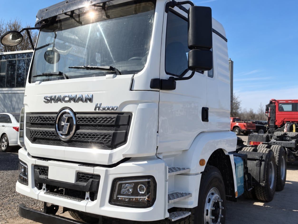 Shacman Delong H3000 6×4 Tractor Truck photographed front three-quarter under a clear sky, white cab