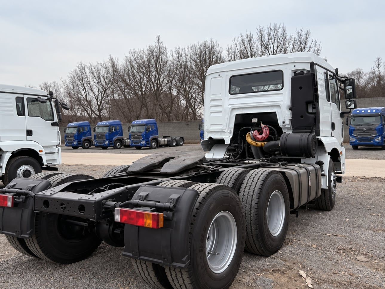 Shacman Delong H3000 6×4 Tractor Truck seen from the rear three-quarter, showing the chassis and the fifth wheel