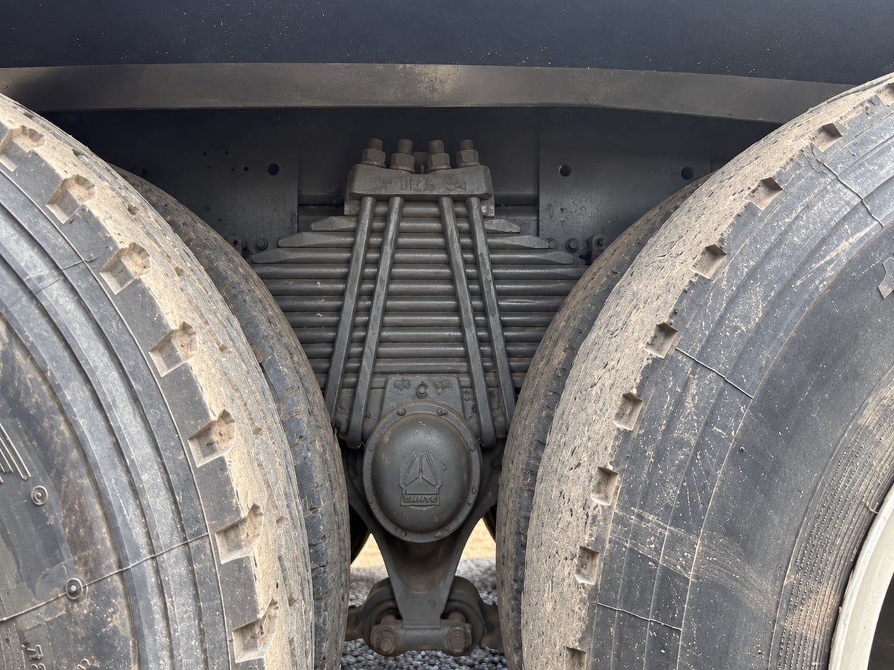 Sinotruk HOWO 8×4 Dump Truck the rear suspension and twin tyres, photographed from below