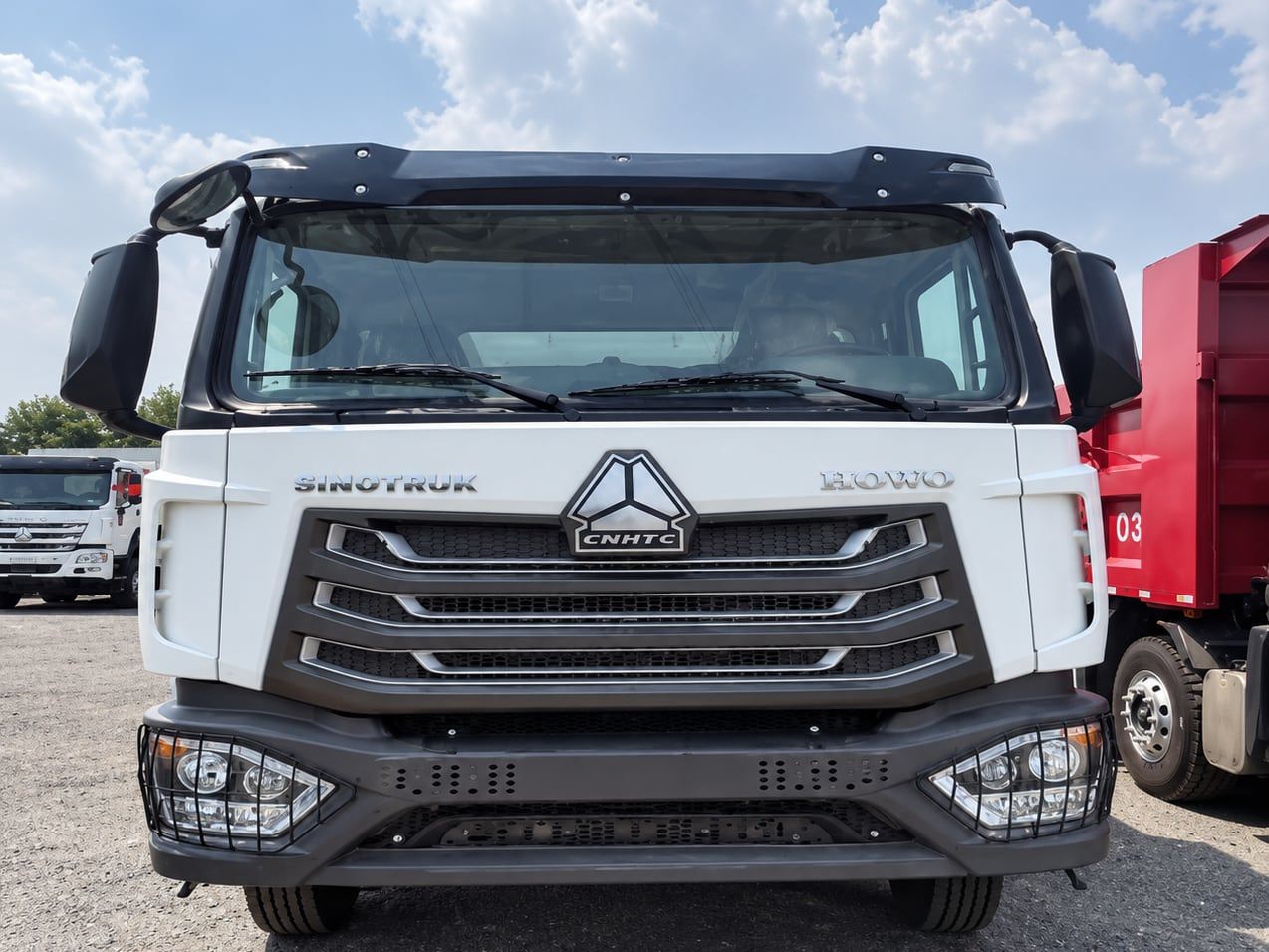 Sinotruk HOWO NX 6×4 Dump Truck photographed front three-quarter, white cab, tipper body behind