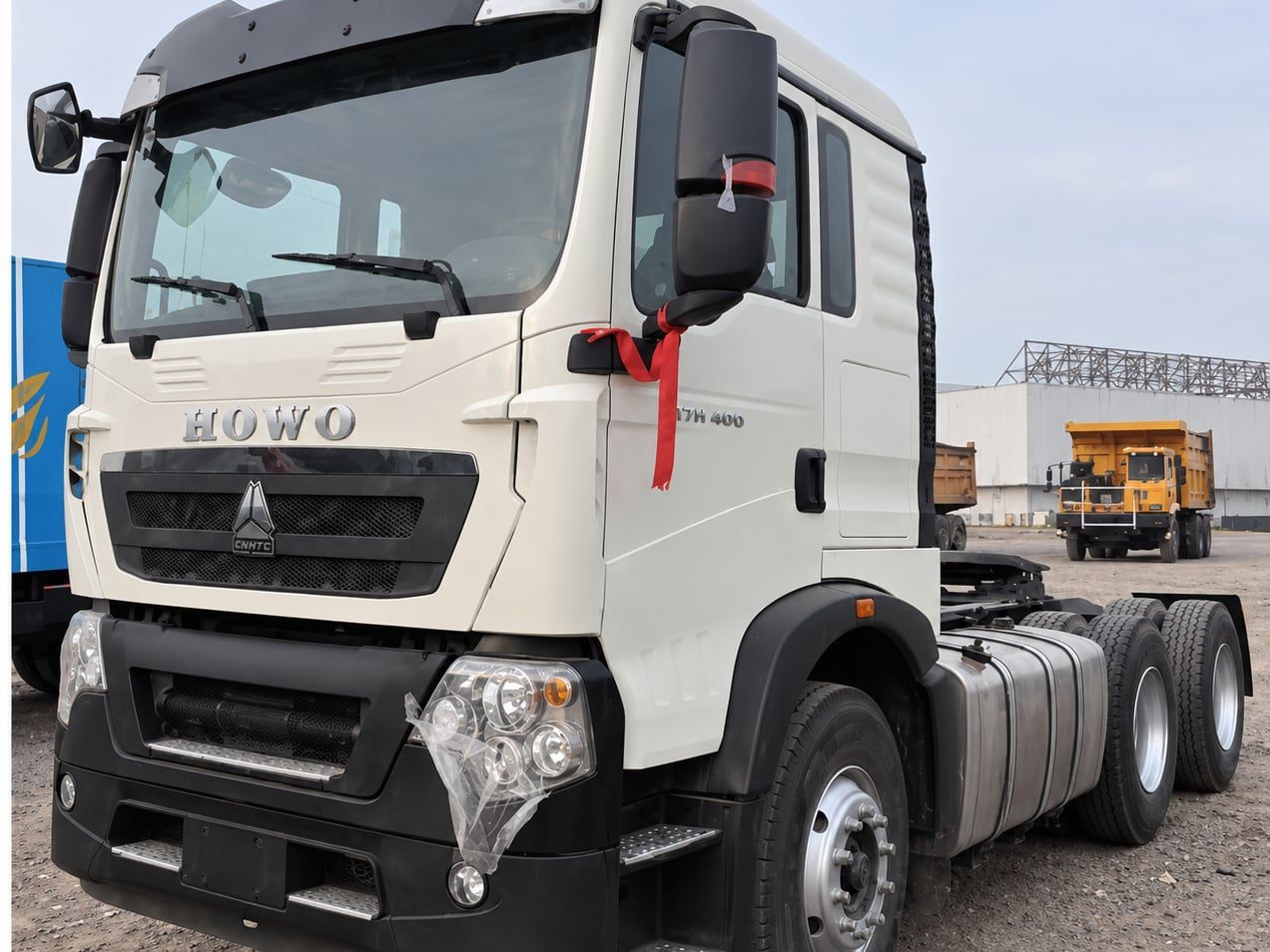 Sinotruk HOWO TX 6×4 Tractor Truck photographed front three-quarter, white cab, chassis and fifth wheel visible